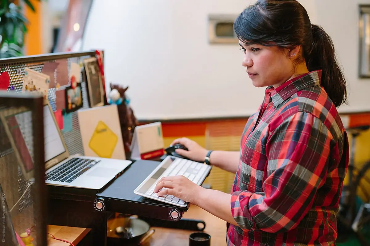 Women on laptop loking at code